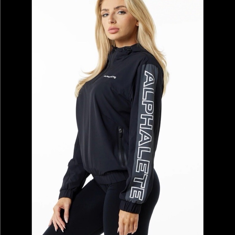 ALPHALETE Women’s EXP Tech Windbreaker- Black Matter